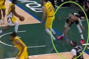 崴脚+膝盖过度伸展!字母哥扣篮落地失衡 捂着左膝! - 资讯配图